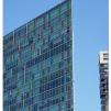 View the image: "Flat" building near the NGV